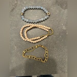 Lot of 3 bracelets. 2 are made of glass. The yellow tone bracelet is very shiny